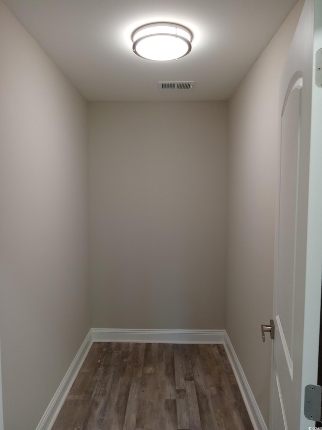 unfurnished room featuring dark hardwood / wood-style flooring