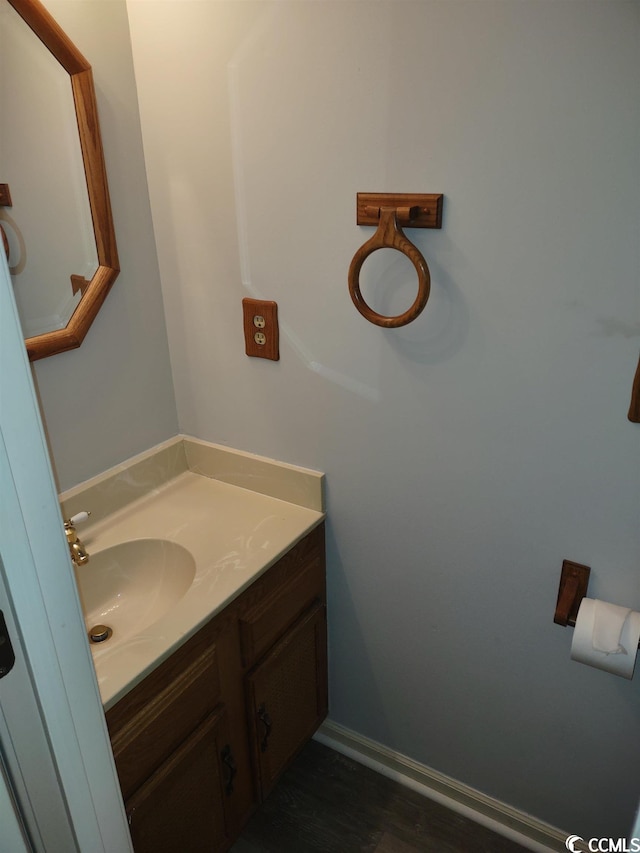 bathroom featuring vanity and hardwood / wood-style flooring