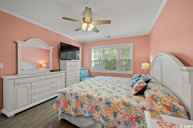 bedroom featuring ceiling fan, crown molding, and dark hardwood / wood-style floors