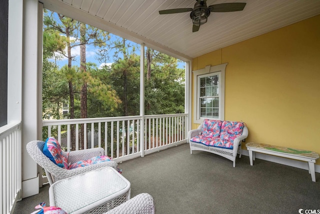 sunroom featuring ceiling fan