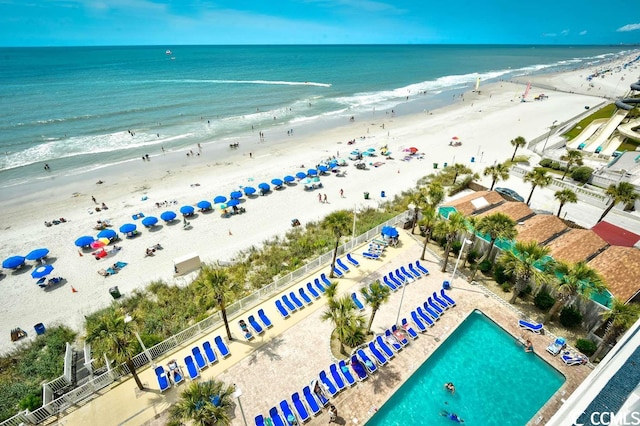 birds eye view of property featuring a view of the beach and a water view