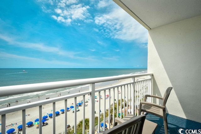 balcony with a beach view and a water view