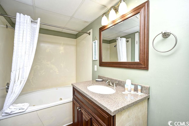 bathroom featuring shower / bath combo, a paneled ceiling, and vanity