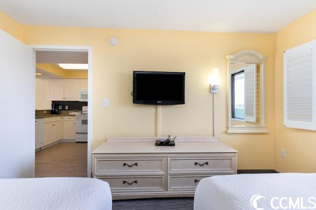 bedroom featuring dark hardwood / wood-style flooring