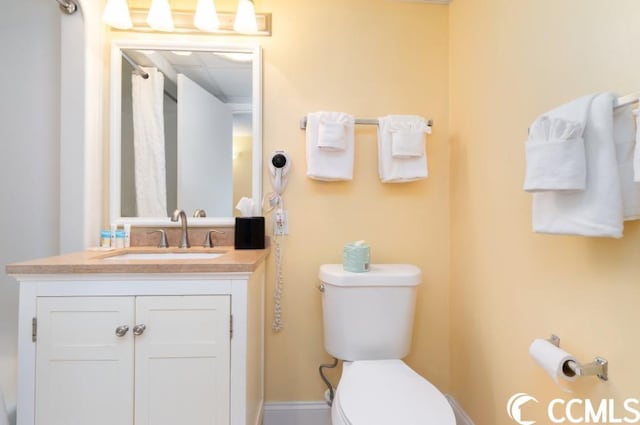 bathroom with vanity and toilet