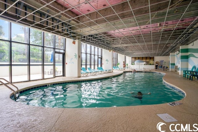 view of pool with a jacuzzi