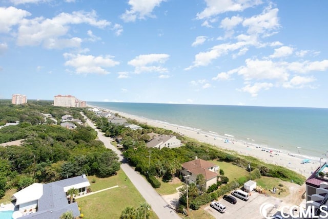 birds eye view of property with a water view and a view of the beach