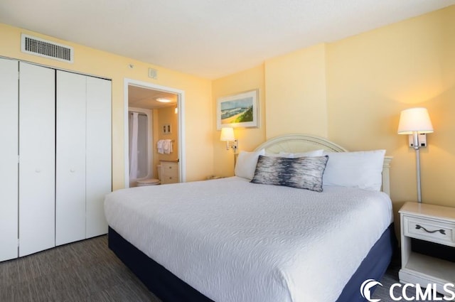 bedroom featuring a closet and dark wood-type flooring