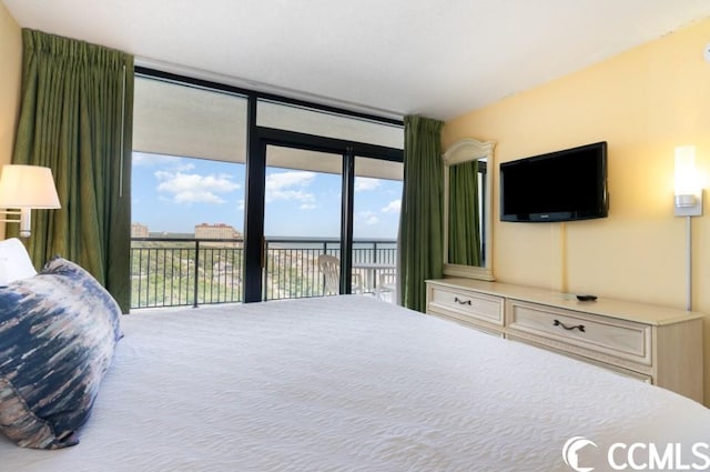 bedroom with access to outside and floor to ceiling windows