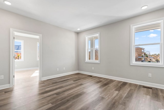 unfurnished room featuring dark hardwood / wood-style floors