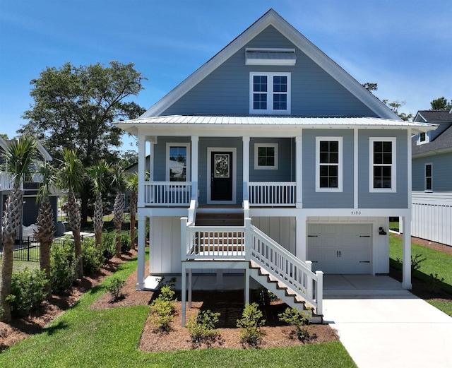 view of front of home featuring a garage and a porch