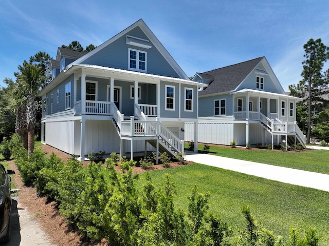 view of front of home with covered porch and a front yard