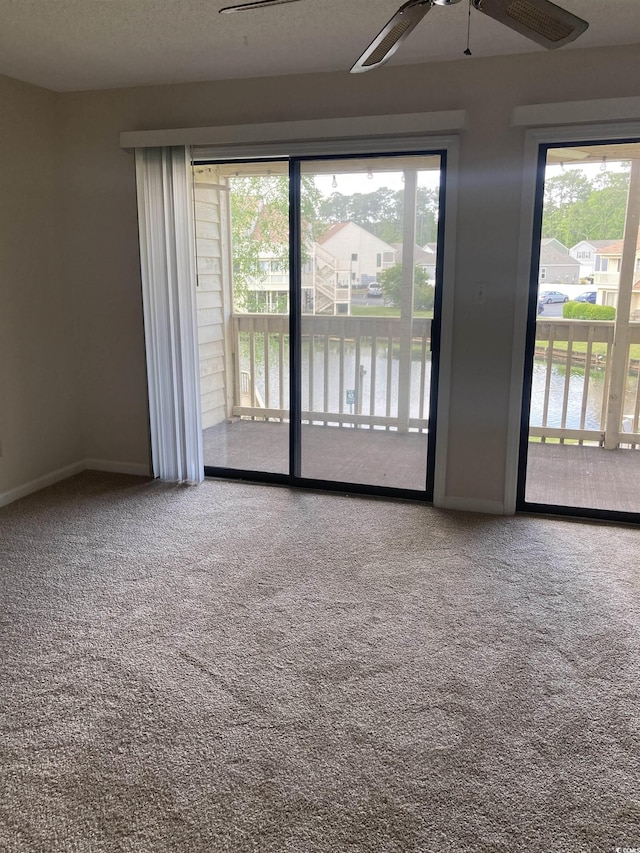 510 Fairwood Lakes Dr Unit 16M, Myrtle Beach, SC 29588 - spare room with ceiling fan, a water view, a healthy amount of sunlight, and carpet