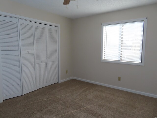 510 Fairwood Lakes Dr Unit 16M, Myrtle Beach, SC 29588 - unfurnished bedroom with ceiling fan, carpet, and a closet