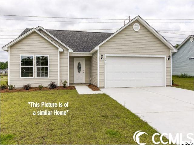 single story home featuring a garage and a front lawn