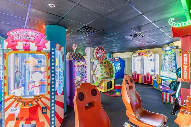 recreation room with a drop ceiling