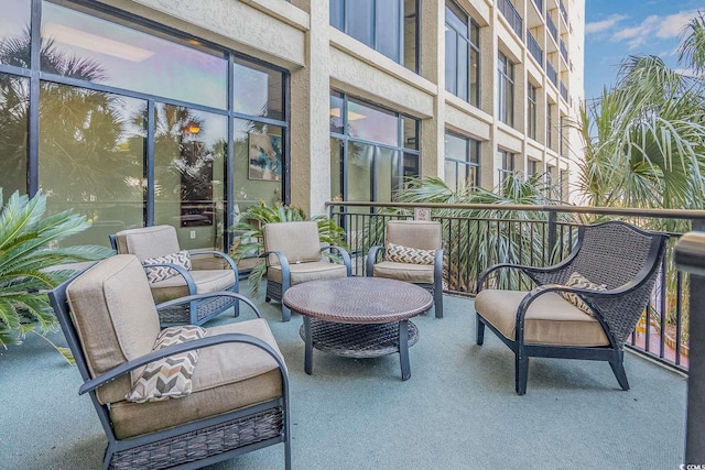 view of patio featuring a balcony