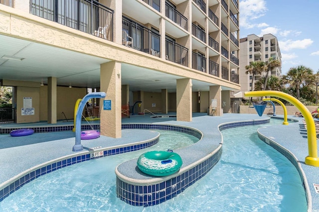 view of pool featuring pool water feature