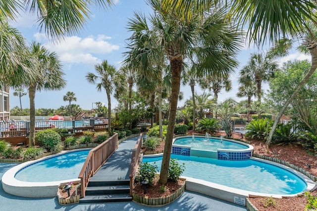 view of pool featuring a jacuzzi