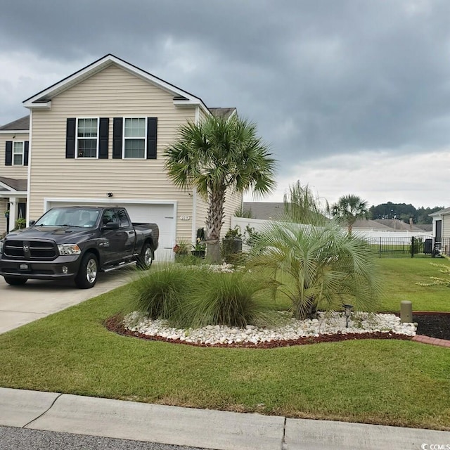 view of front facade featuring a front lawn and a garage