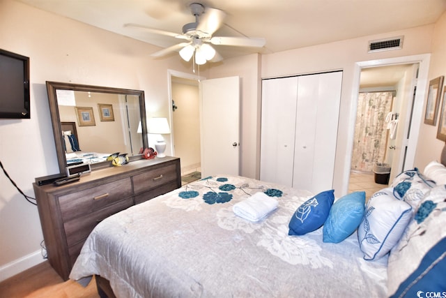 bedroom featuring ensuite bathroom and ceiling fan