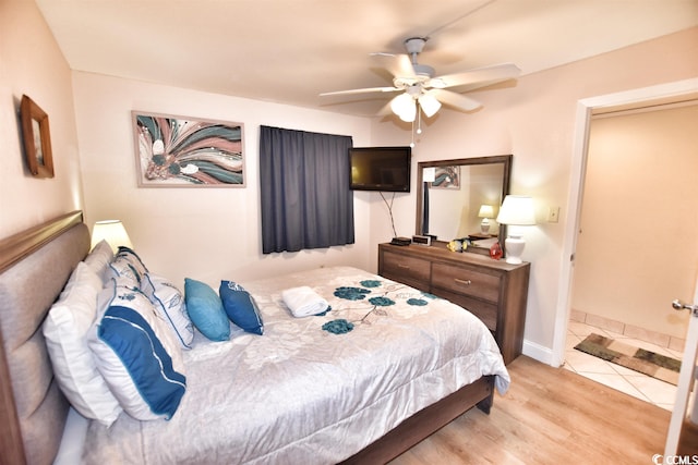 bedroom with light hardwood / wood-style floors and ceiling fan