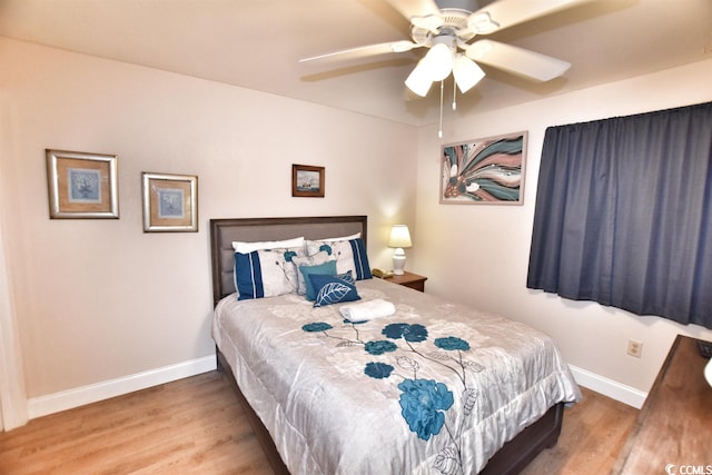 bedroom featuring ceiling fan and light hardwood / wood-style floors