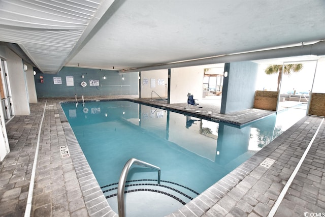 view of pool featuring a hot tub