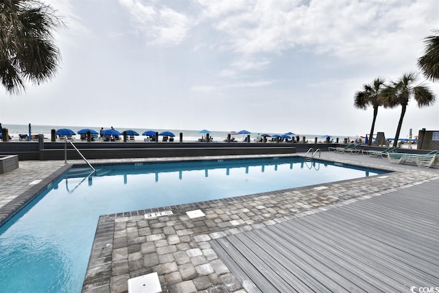 view of pool featuring a patio