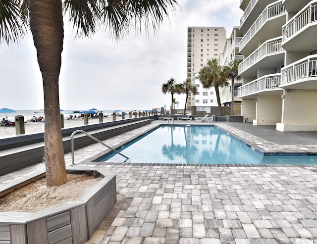 view of pool featuring central AC unit