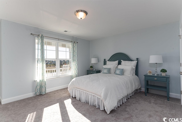 bedroom featuring carpet, visible vents, and baseboards