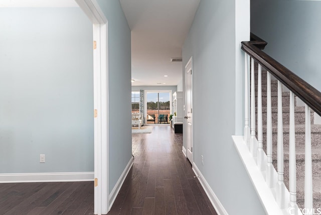 hall featuring dark wood-style floors, recessed lighting, visible vents, stairway, and baseboards