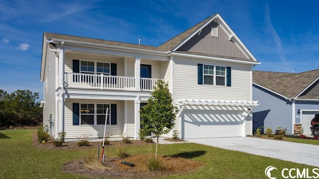 view of front of home with a garage, board and batten siding, a front lawn, and concrete driveway