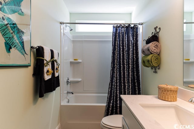 bathroom featuring toilet, shower / bathtub combination with curtain, and vanity