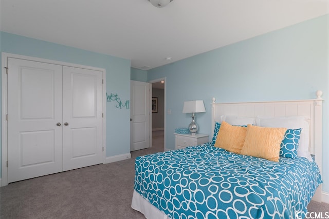 bedroom with carpet, baseboards, and a closet