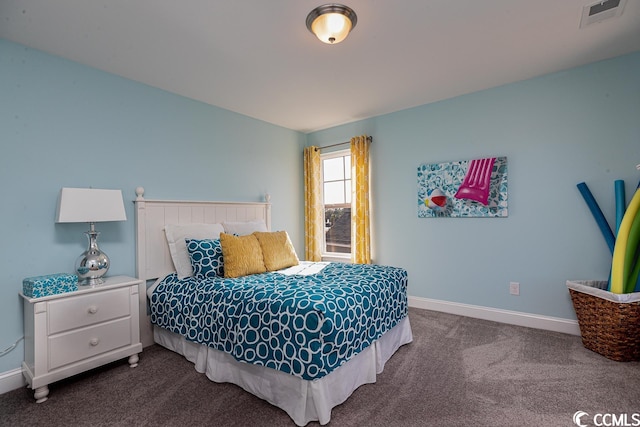 bedroom featuring baseboards, visible vents, and dark colored carpet