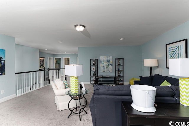 living area featuring baseboards, carpet flooring, and recessed lighting