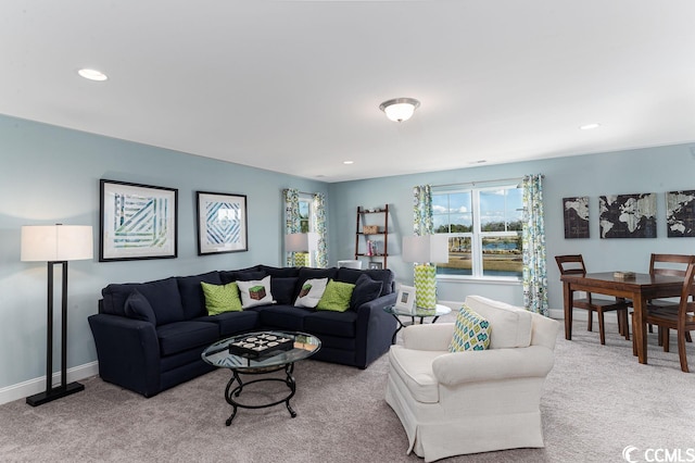 living area with recessed lighting, carpet flooring, and baseboards