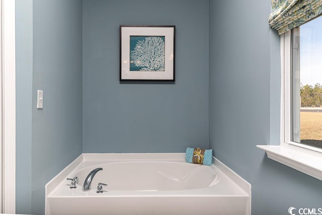 bathroom with a garden tub