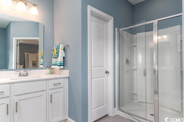 full bathroom with a stall shower and vanity