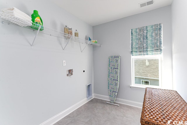 laundry room with washer hookup, visible vents, electric dryer hookup, laundry area, and baseboards