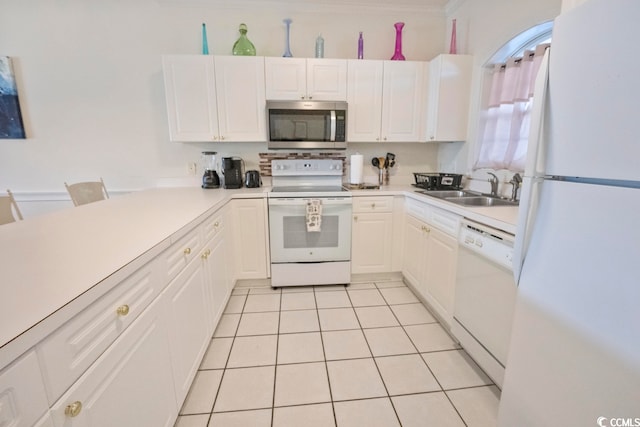 4856 Carnation Cir Unit 304, Myrtle Beach, SC 29577 - kitchen featuring white appliances, sink, white cabinetry, and light tile floors