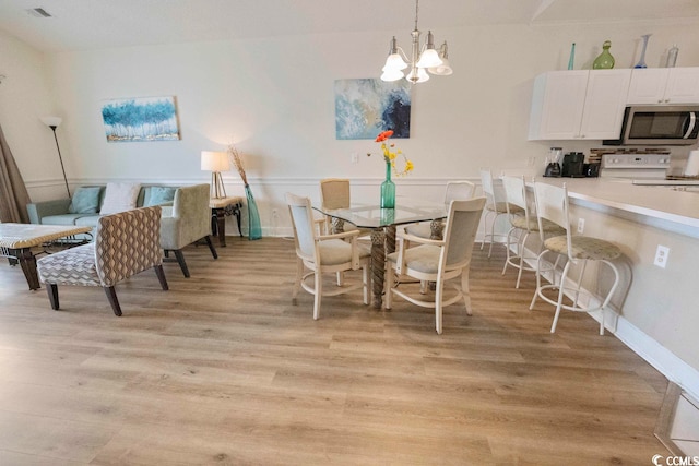 4856 Carnation Cir Unit 304, Myrtle Beach, SC 29577 - dining room with a notable chandelier and light hardwood / wood-style flooring