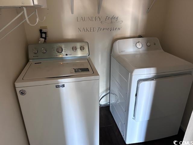 clothes washing area featuring washing machine and dryer