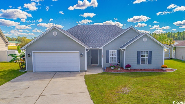 view of front of house with a front lawn and a garage