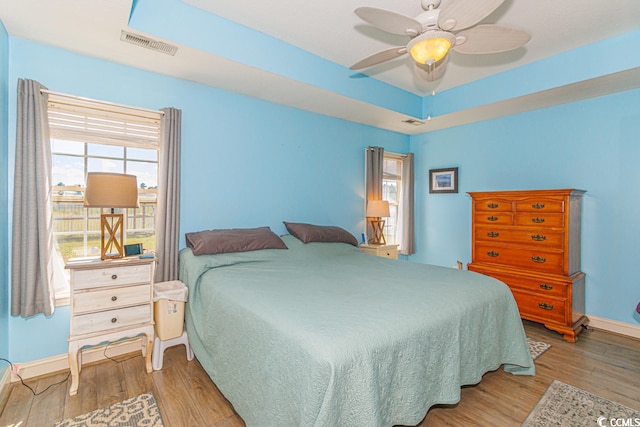 bedroom featuring light hardwood / wood-style flooring and ceiling fan