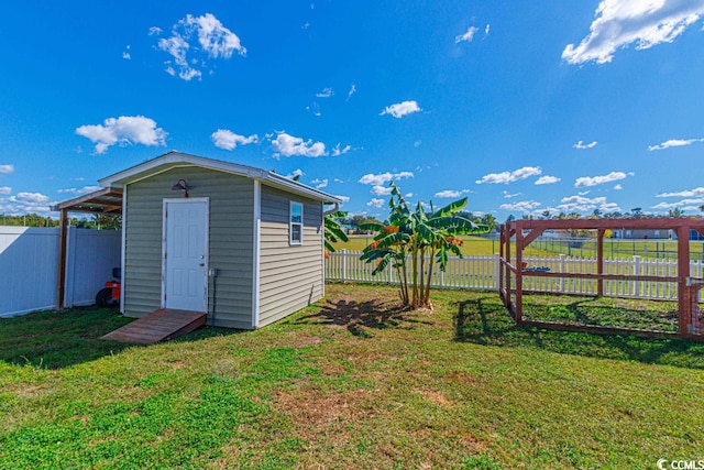 view of outdoor structure featuring a yard