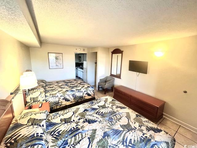 tiled bedroom with a textured ceiling