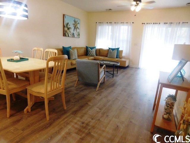 interior space with dark hardwood / wood-style floors and ceiling fan