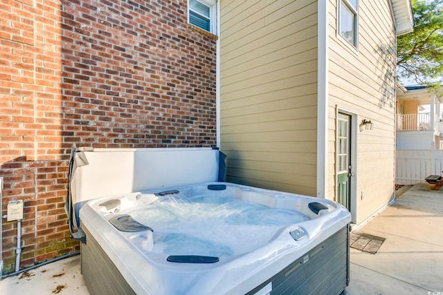 view of patio / terrace with a hot tub